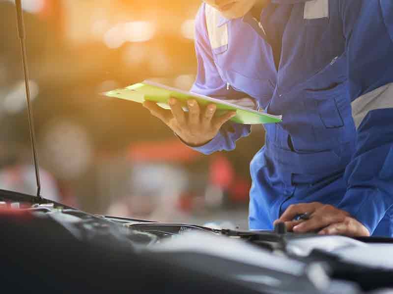 McCarthy Collision Center in Olathe KS customer receiving keys to newly repaired car