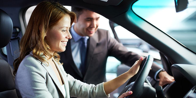 McCarthy Collision Center in Olathe KS customer looking at new windshield