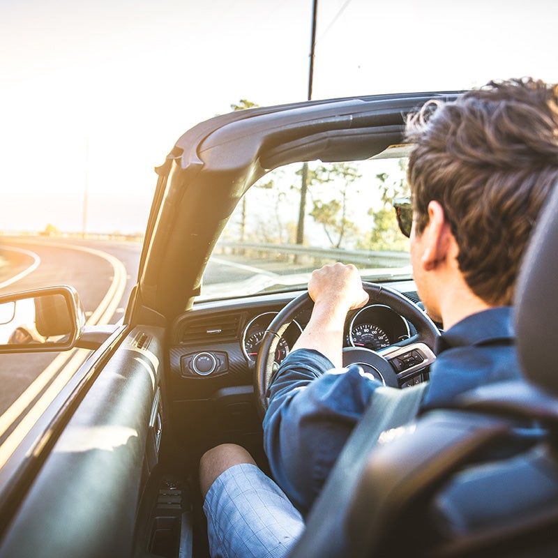 McCarthy Collision Center in Olathe KS customer driving in newly repaired car